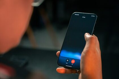 A person holding a cell phone in their hand